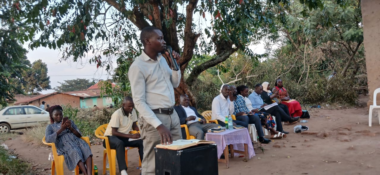 A Kagadi Town Council leader presenting to citizens during a dialogue meeting